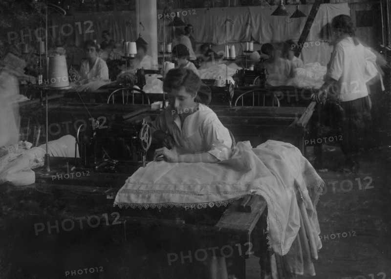 Hemming curtains on machine  1917