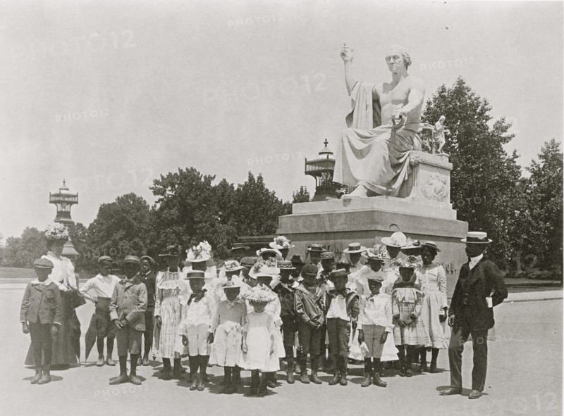 Group of school children in front of statue of George Washington, Washington, D.C. 1899
