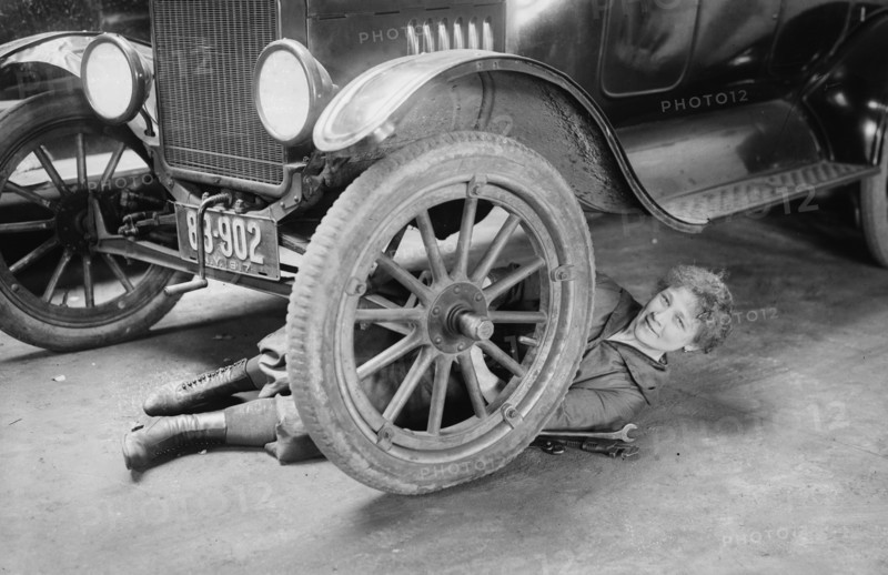 Helen J. Owen, in New York repairing a car