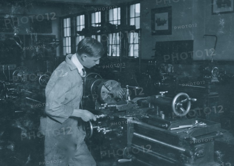 High School boy at work in machine shop. Oklahoma City High School 1917