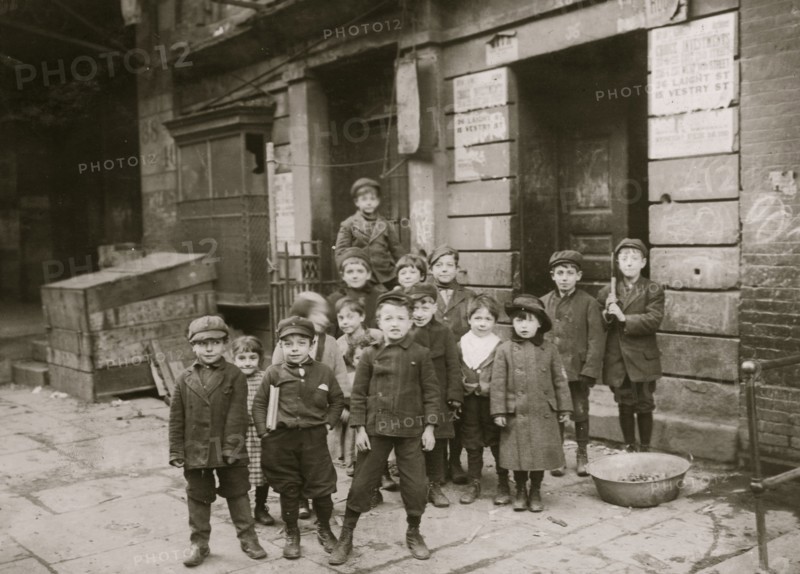 In an alley back of a moving picture theatre on First Street. Children were hanging about the "stage" entrance--"peeking in."  1910