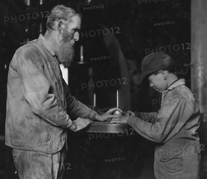 Indiana Mfg. Co. Peru, Ind. The old and the new. Old man has been there 33 years. Boy starting in, working with a board saw 1908