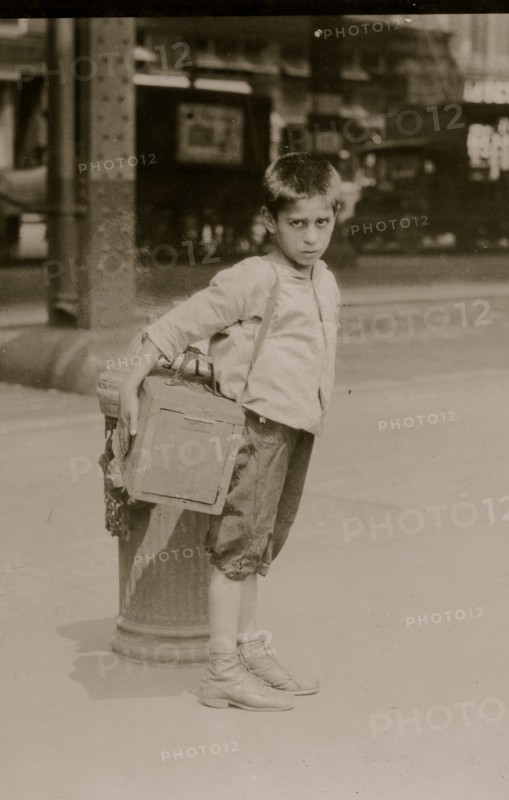 Jimmie, a seven year old bootblack, working on Canal Street, N.Y. City - July 25, 1924. 1924