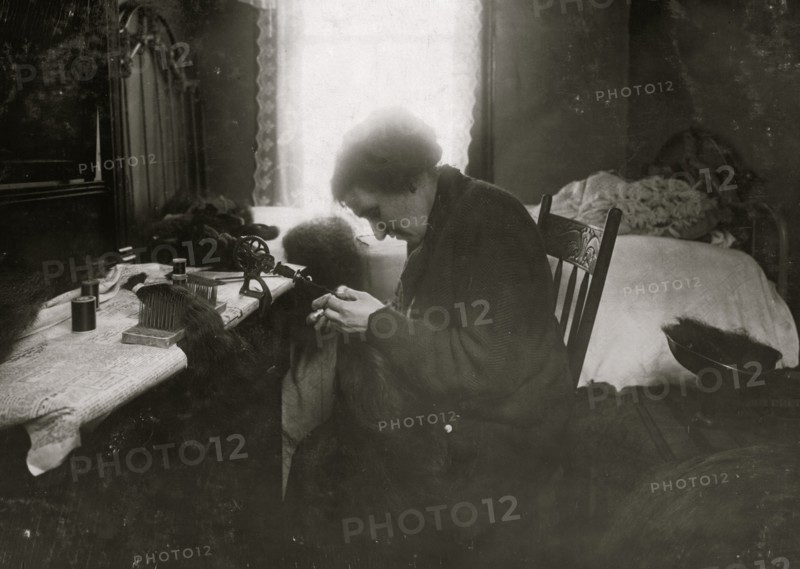 Making hair-goods in a tiny hall-bedroom. 1912