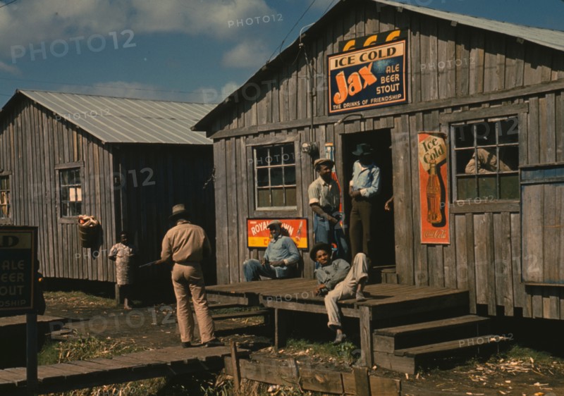 Living quarters and "juke joint" for migratory workers, a slack season; Belle Glade, Fla. 1941