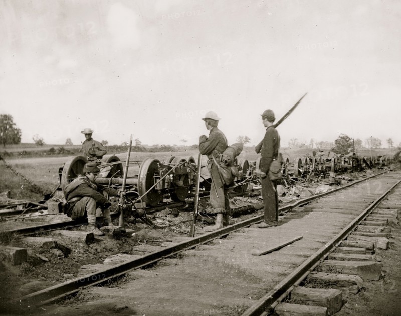 Manassas Junction, Va. Soldiers beside damaged rolling stock of the Orange & Alexandria Railroad 1862