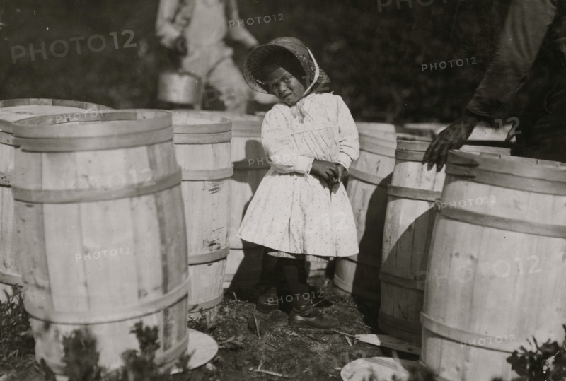 Mary Christmas, nearly 4 years old. Picks cranberries sometimes. She is now picking up berries spilled at the barrels by Grandfather.  1911