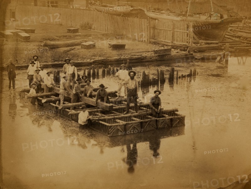 Military construction in northern Virginia: raft of blanket boats ferrying men and timber across the Potomac River