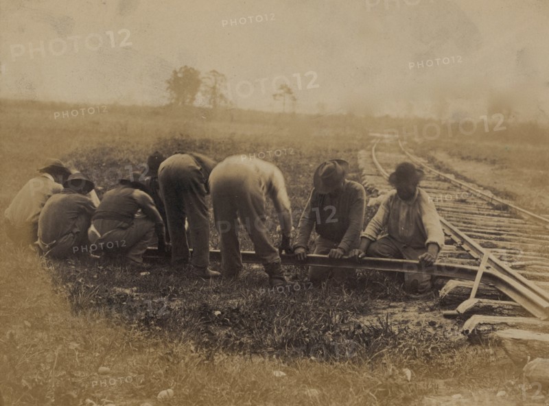 Military railroad operations in northern Virginia: African American laborers twisting rail 1863