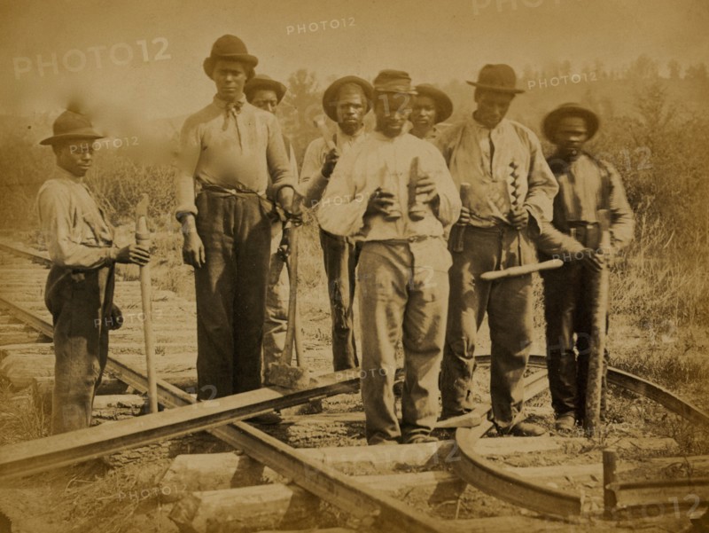 Military railroad operations in northern Virginia: men standing on railroad track 1863