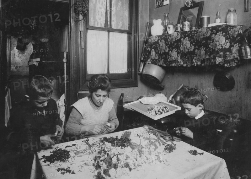 Mrs. A.L.A. She & her 3 children - 11, 9, & 6 yrs old work at flower making.  1924