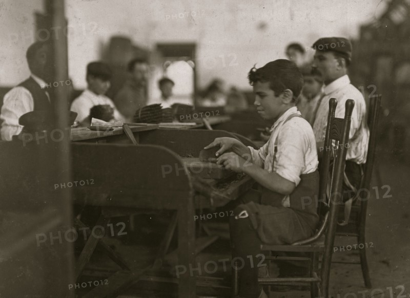One of the smallest apprentices I found. (Work being slack.) De Pedro Casellas Cigar Factory, Tampa, FL 1909