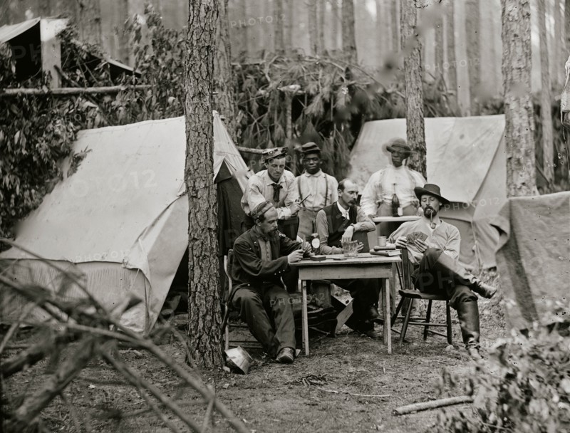 Petersburg, Va. Officers of the 114th Pennsylvania Infantry playing cards in front of tents 1864