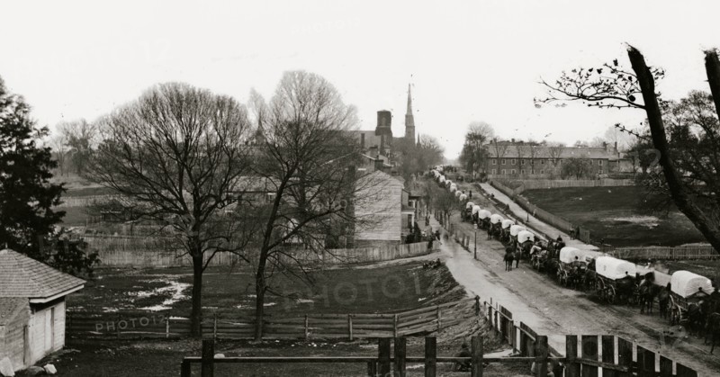 Petersburg, Virginia. The first Federal wagon train entering the town 1865