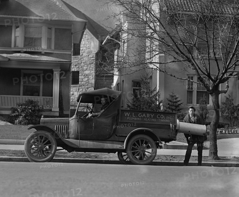 Plumbing & Heating Contractors Unload a Boiler 1926