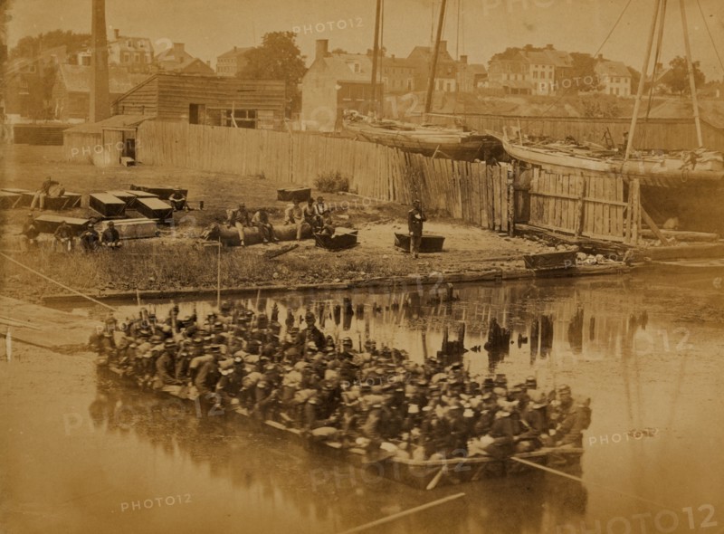 Raft of blanket boats ferrying field soldiers across the Potomac River 1863