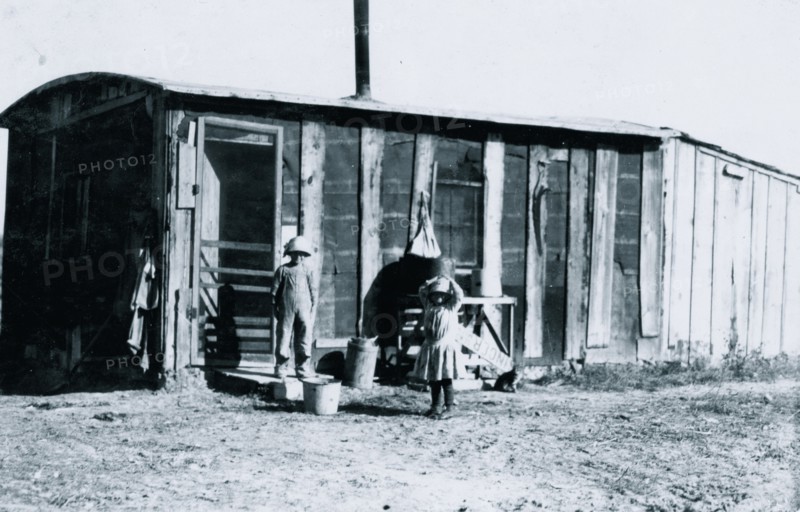 Shack in which the Reibers live, 10 x 15 ft. with a small shed attached 1915