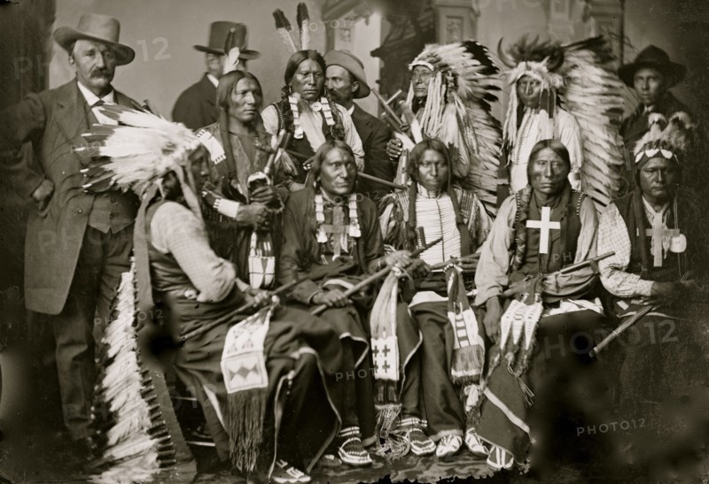 Sioux and Arapahoe Indian Delegations. L to R Seated - Red Cloud, Big Road, Yellow Bear, Young Man Afraid of his Horses, Iron Crow. L to R Standing - Little Bigman, Little Wound, Three Bears, He Dog 1875