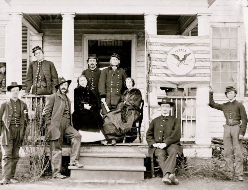 Stevensburg, Va. Gen. Judson Kilpatrick, 3d Division, Cavalry Corps, with ladies and staff members on the porch of headquarters 1864