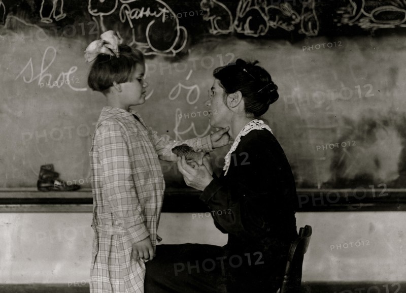 Teaching a deaf-mute to talk. Training School for Deaf Mutes. 1917