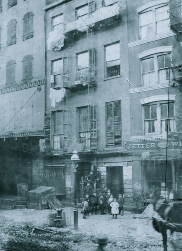 Tenement house with children in front. Possibly 36 Laight St. 1910