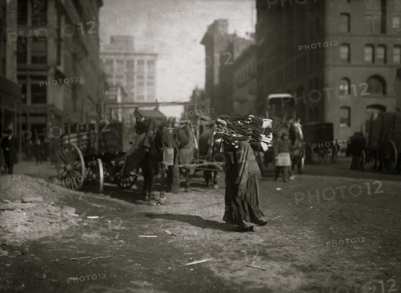 The breaking point. A heavy load of garnets for an old woman. 1912