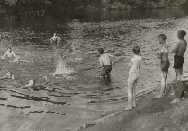 Tobacco workers take a break at a swimming hole. 1916