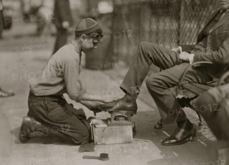 Tony, a twelve year old bootblack at his station in Bowling Green, New York City.  1924