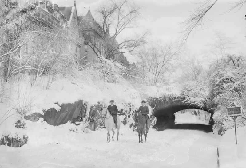 Two Horseback Riding during a Snowfall in Manhattan's Central Park