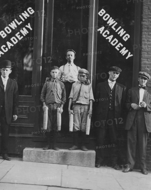 Two of the "pin boys" working in Bowling Academy with 3 other small boys until 10 or 11 P.M. some nights. 1910