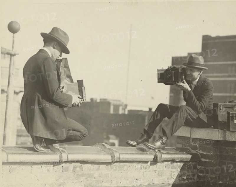 High Up Cameramen Shoot Each other