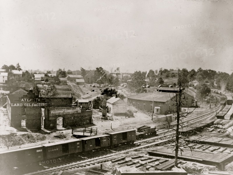 View of Atlanta, Georgia, with railroad cars in left foreground 1863