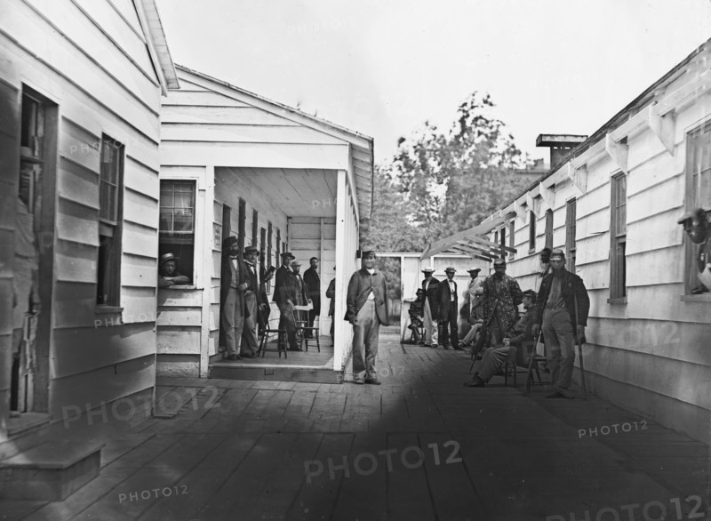 Washington, D.C. Convalescent soldiers and others outside quarters of the Sanitary Commission Home Lodge 1865