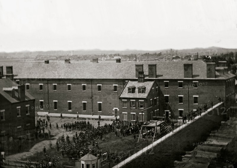 Washington, D.C. Execution of the conspirators: scaffold in use and crowd in the yard, seen from the roof of the Arsenal 1865