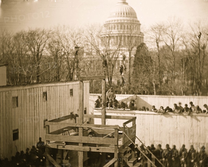 Washington, D.C. Hooded body of Captain Wirz hanging from the scaffold 1865