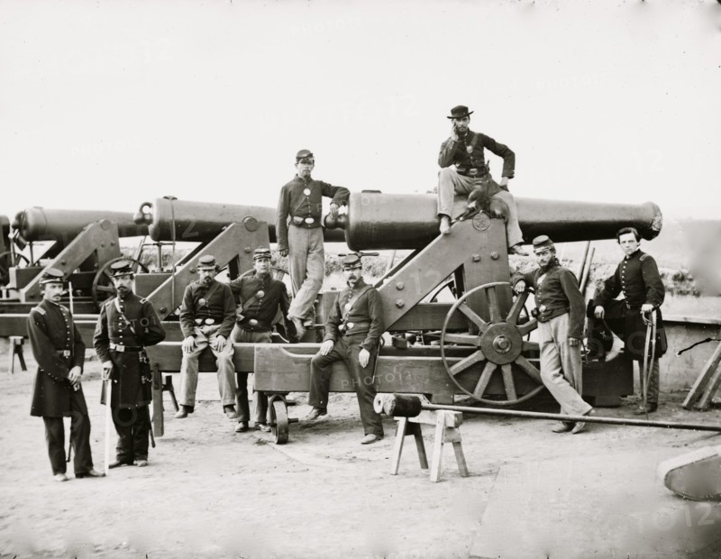 Washington, District of Columbia. Officers and men, 3d Regiment Massachusetts Heavy Artillery by Columbiad guns, Fort Totten 1865