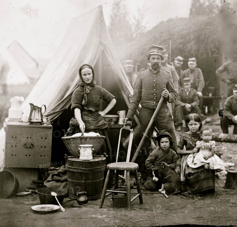 Washington, District of Columbia. Tent life of the 31st Penn. Inf. (later, 82d Penn. Inf.) at Queen's farm, vicinity of Fort Slocum; husband and wife with Children and a baby; wife does wash 1861