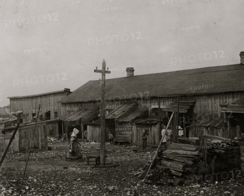 About 50 persons housed in this miserable row of dilapidated shacks located on an old shell-pile and partly surrounded by a tidal marsh.  1912