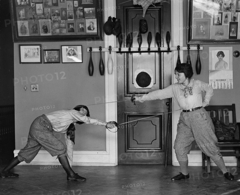 Women's Fencing in Gym as posed without Protection