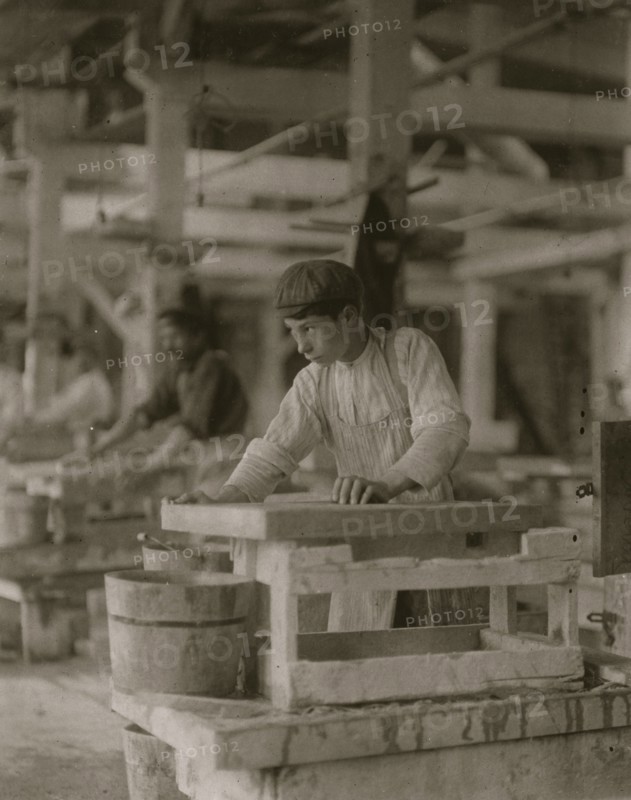 Young boy polishing marble in Vermont Marble Co., 1910