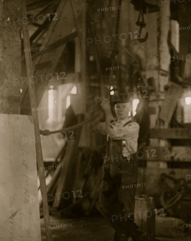 Young boy running machine in Vermont Marble Co., Centre Rutland, VT 1910