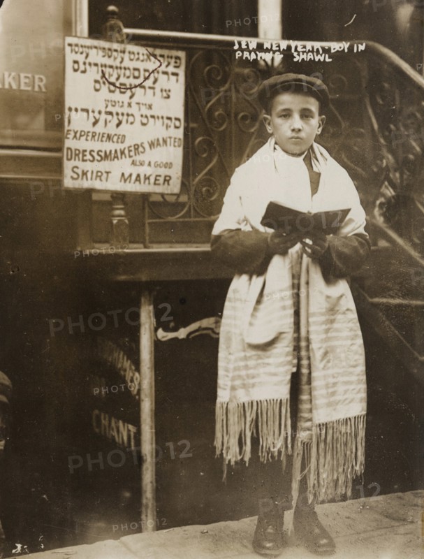 Jewish Boy in Prayer shawl and Sidur celebrates the Hebrew New Year