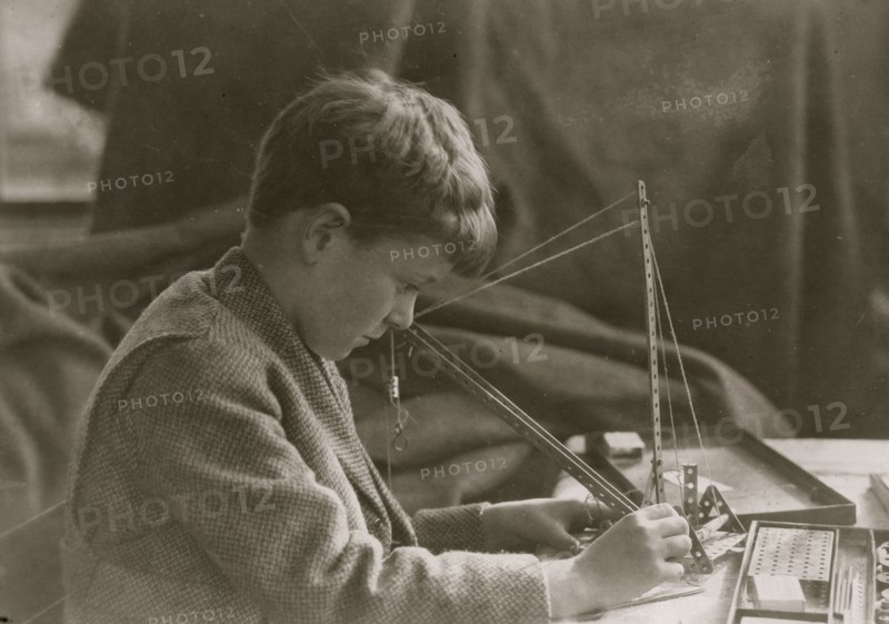 Young Boy with a Mechanical Toy 1924
