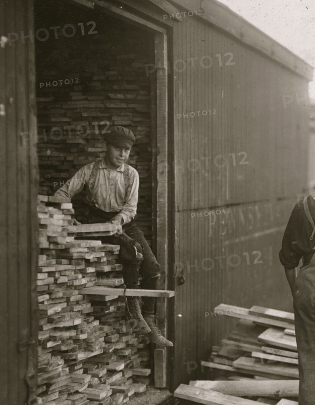 Young boy working for Hickok Lumber Co. Location: Burlington, Vermont. 1910