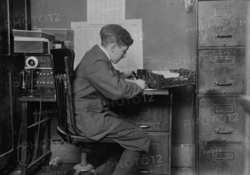 Young office boy, working for J.J. O'Brien and Sons 1917