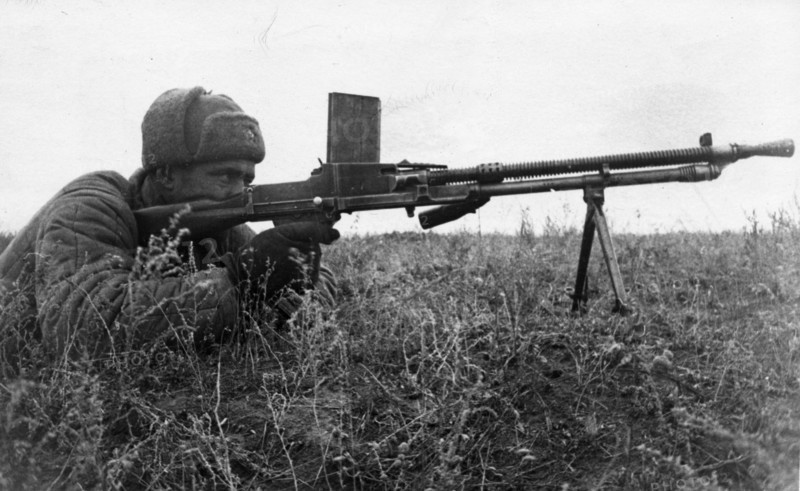 World war 2, battle of stalingrad, southwest of stalingrad, soviet senior sergeant kondrashev with a captured machinegun, he was the first to break into an enemy blockhouse killing 3 soldiers and capturing the machinegun and proceding to mow down the enemy with it, january 1943.