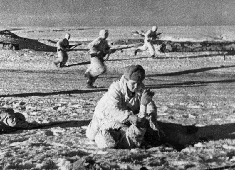 World war 2, battle of stalingrad, a medic rendering first aid to a wounded red army man northwest of stalingrad, january 1942.