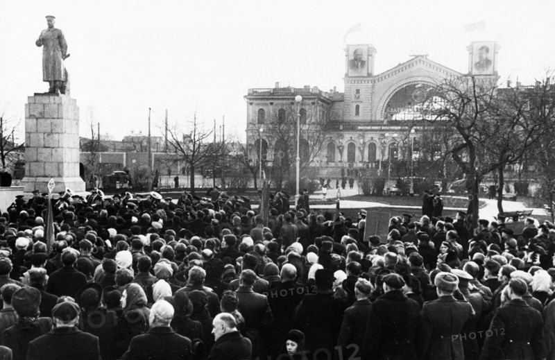 A crowd gathered for the unvailing of a new monument to joseph stalin erected in front of the baltic railway station in leningrad, november 1949.