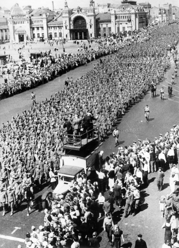 Such was the inglorious end of the nazi campaign against the soviet union, shown here are columns of war prisoners marching despondently through the streets of moscow, 1945.