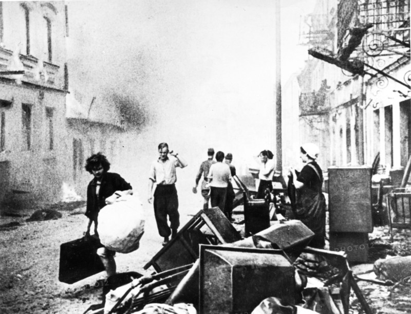 world war ll: the conflagration casts a sinister glow on the chaos of nazi destruction in the streets of minsk.